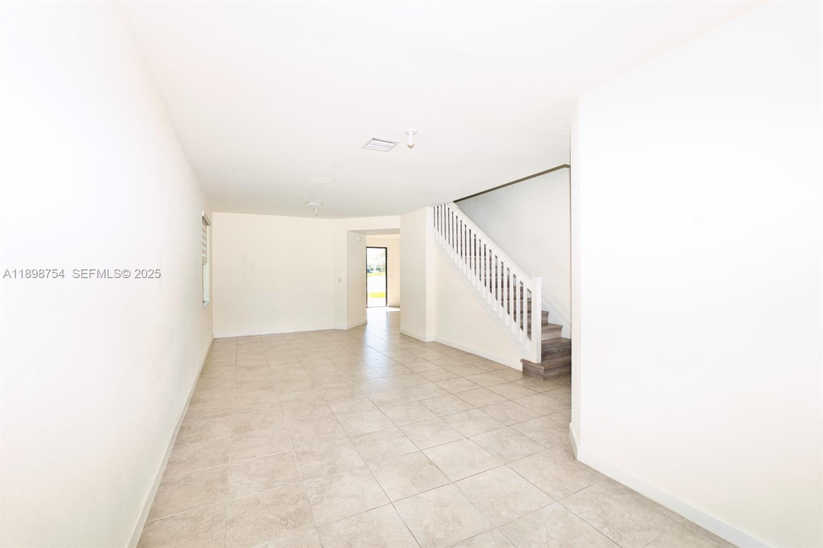 3412 West 103rd Terrace Hialeah, FL 33018 - Photo 4 of 44 a view of an empty room