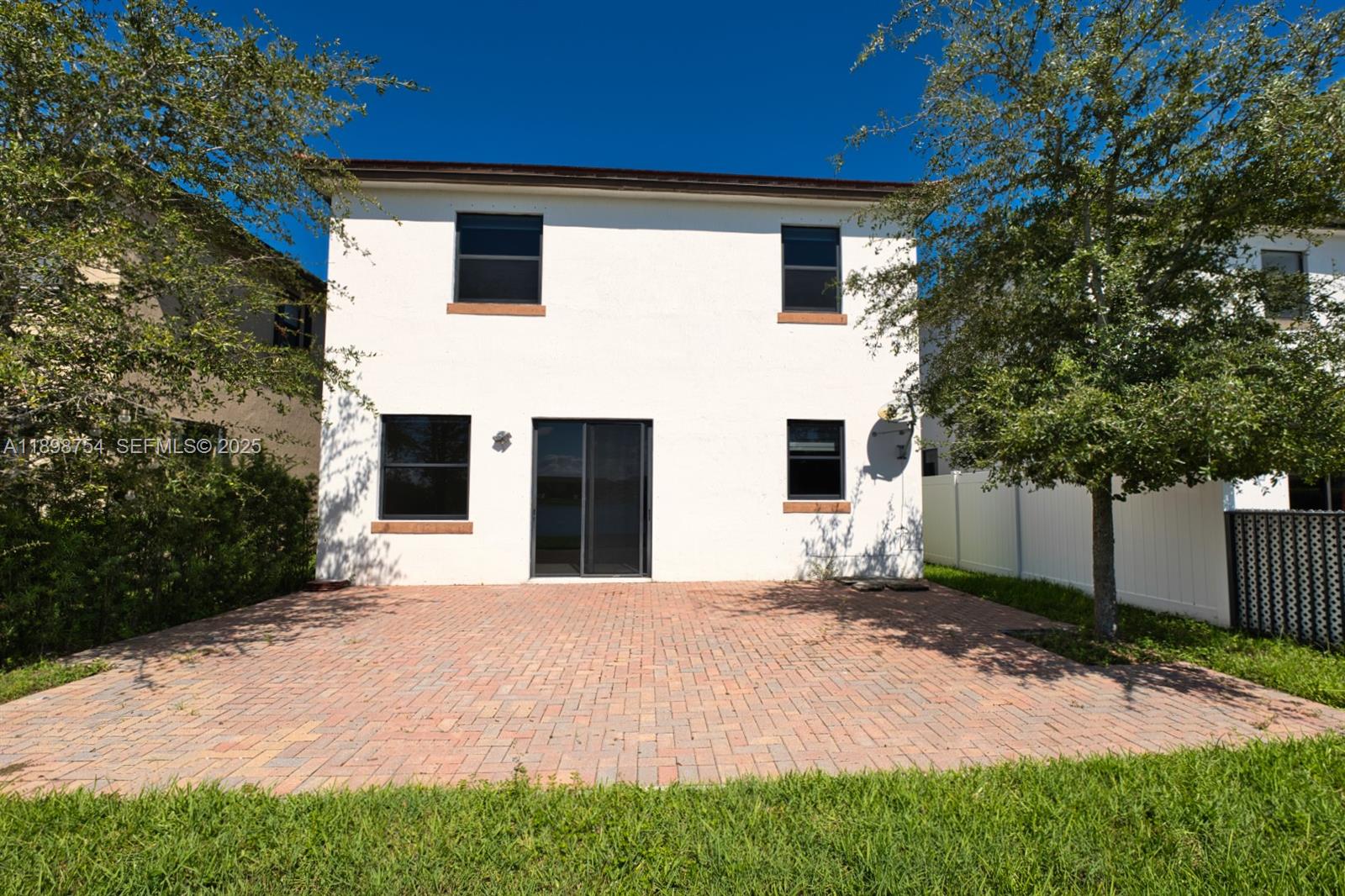 3412 West 103rd Terrace Hialeah, FL 33018 - Photo 41 of 44 a front view of a house with a yard