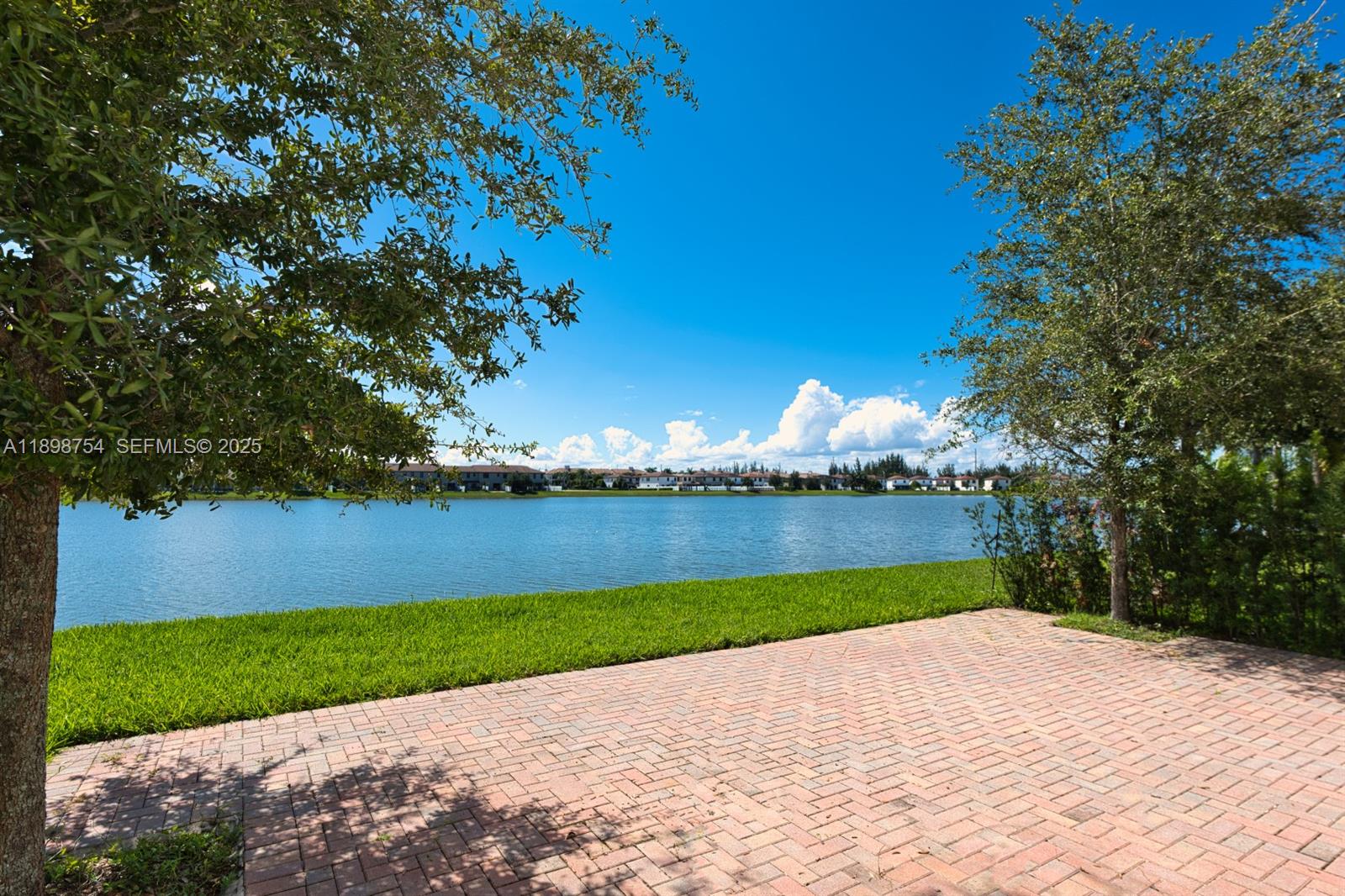 3412 West 103rd Terrace Hialeah, FL 33018 - Photo 43 of 44 a view of a lake and a yard