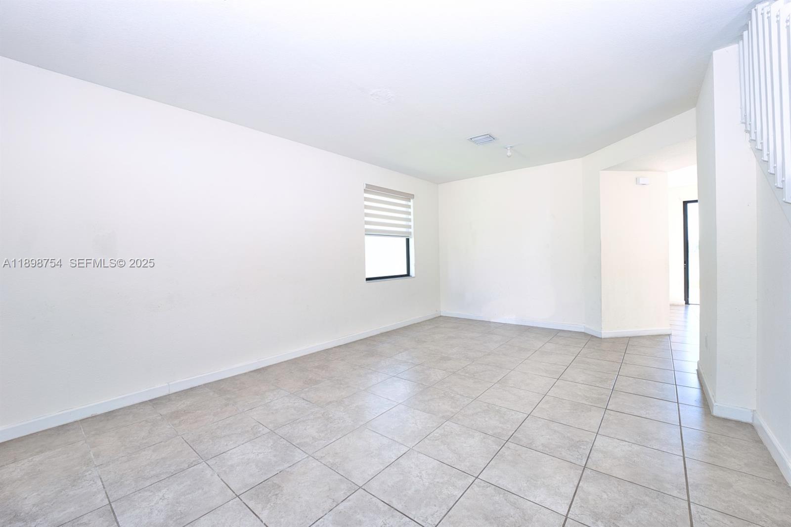 3412 West 103rd Terrace Hialeah, FL 33018 - Photo 6 of 44 a view of an empty room