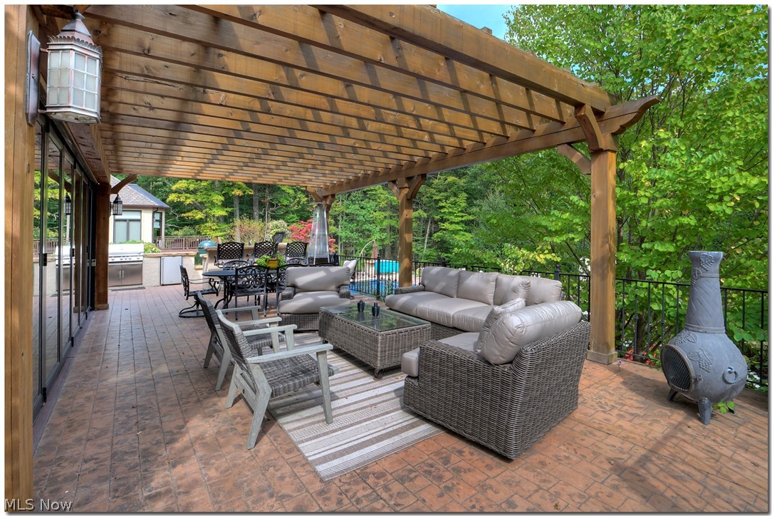 2783 Som Center Road Chagrin Falls, OH 44022 - Photo 26 of 33 Enjoy the warm summer months on the patio off the 4 season room offering a pergola, outdoor kitchen area and fabulous views