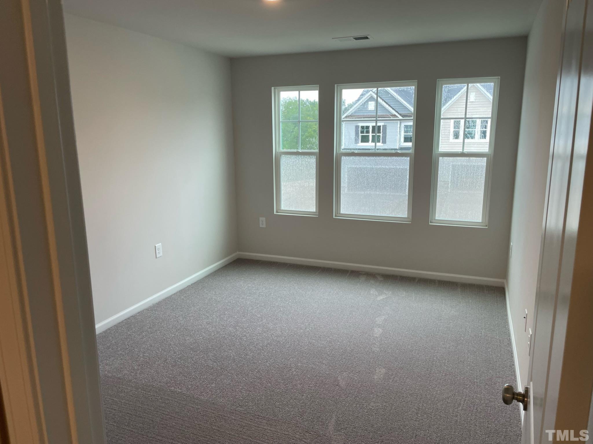 4914 Oolite Street, Unit 15 Raleigh, NC 27610 - Photo 12 of 21 an empty room with a window