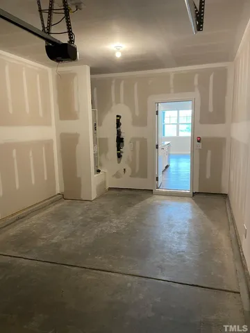 a view of empty room with ceiling fan