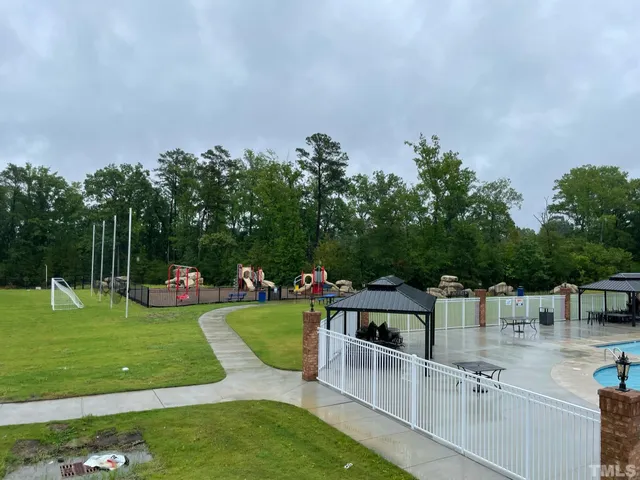 a view of a chairs and table on the garden