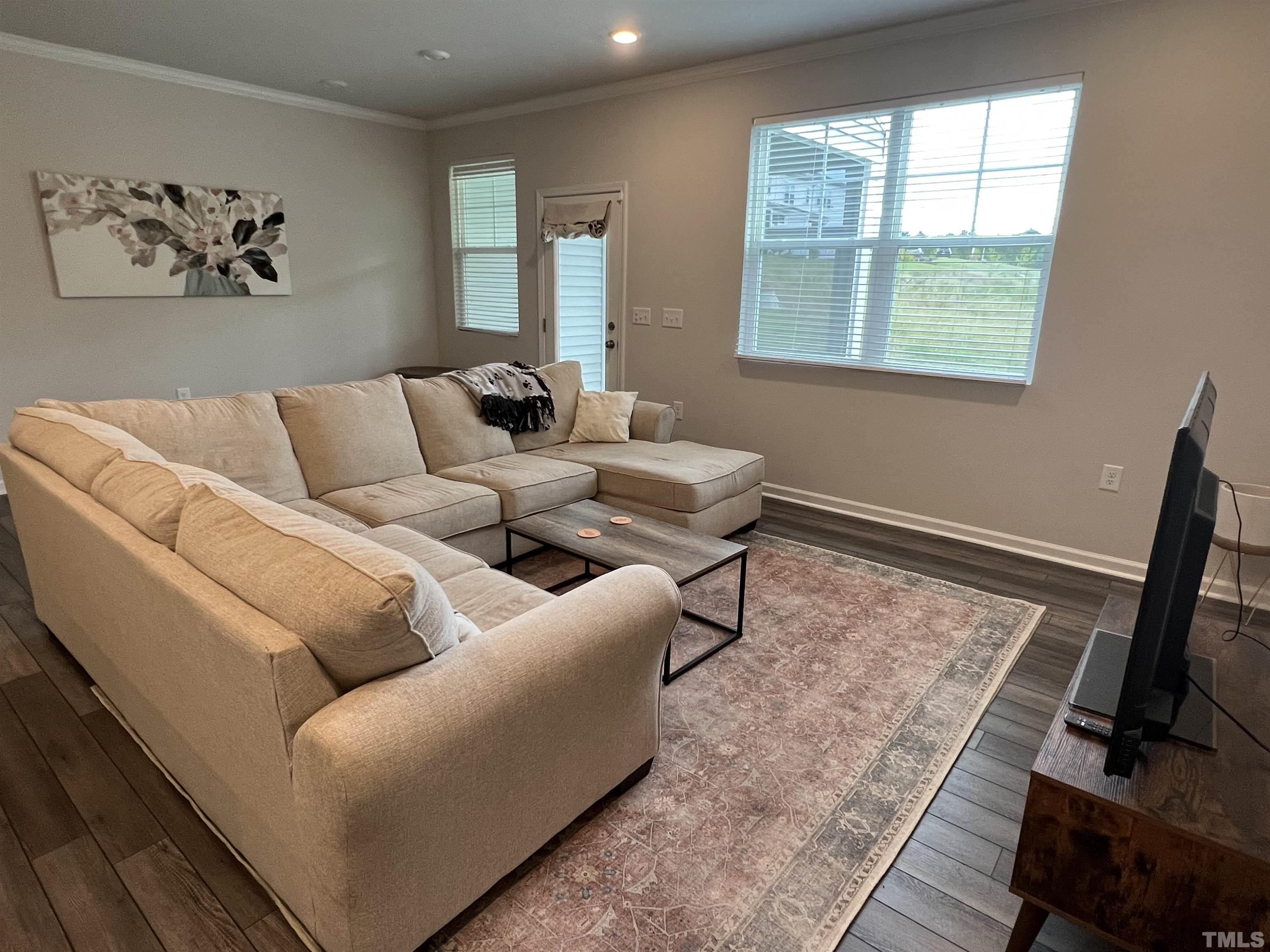 4914 Oolite Street, Unit 15 Raleigh, NC 27610 - Photo 5 of 21 a living room with furniture and a window