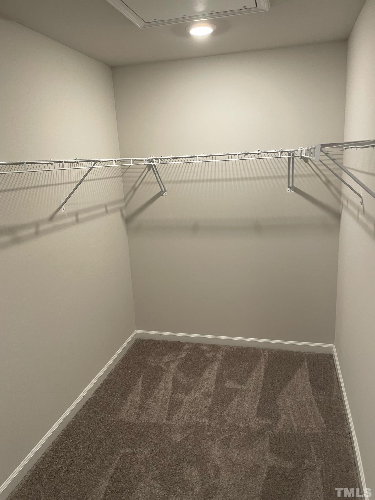 4914 Oolite Street, Unit 15 Raleigh, NC 27610 - Photo 8 of 21 a view of a room with racks on the wall