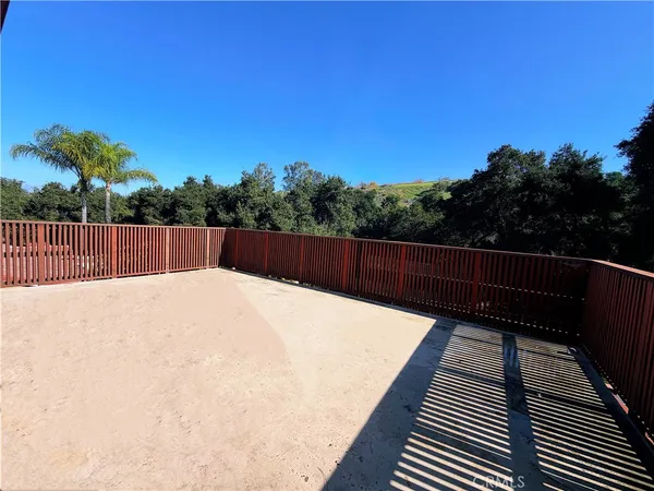 a view of balcony with wooden floor