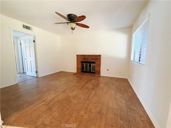 a view of empty room with a ceiling fan