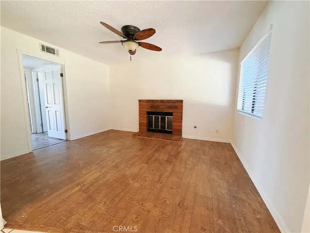 a view of empty room with a ceiling fan
