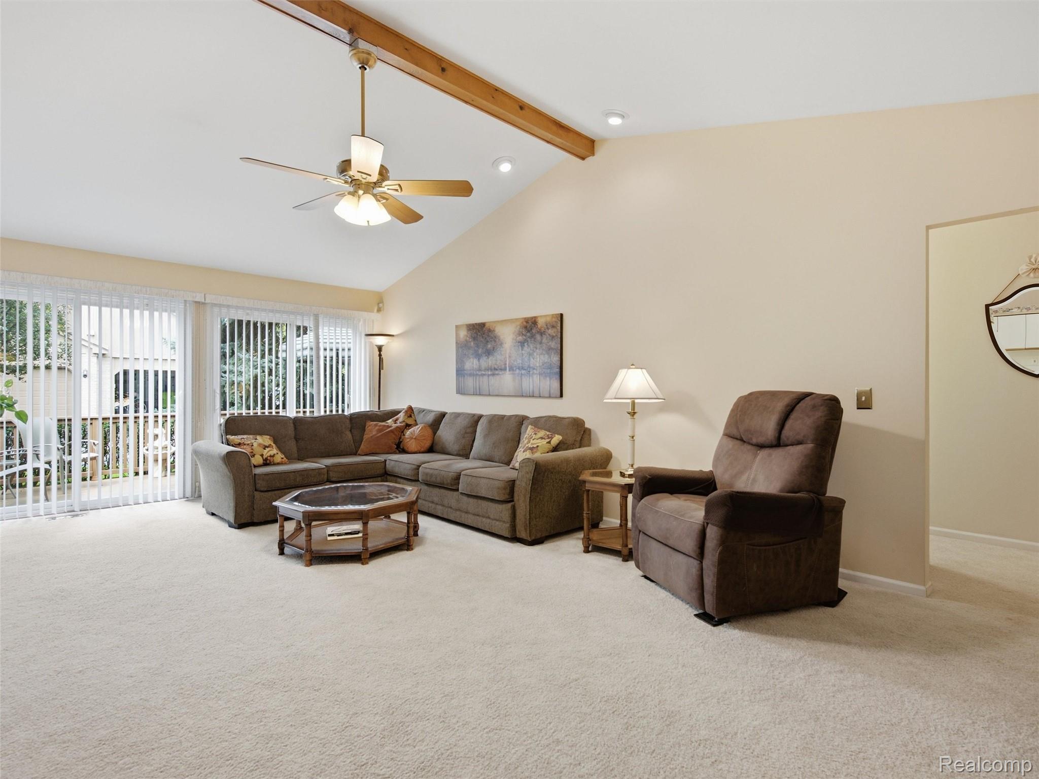 2195 London Bridge Drive Rochester, MI 48307 - Photo 14 of 30 Vaulted ceiling with an exposed wood beam, ceiling fan, recessed lighting, and sliding glass doors