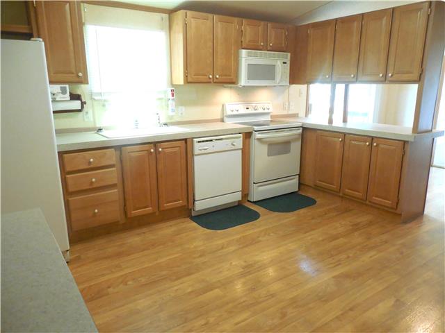 2410 Sylvia Road Dickson, TN 37055 - Photo 2 of 19 This kitchen is HUGE! It includes plenty of cabinet and bar space.