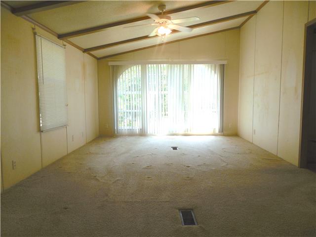 2410 Sylvia Road Dickson, TN 37055 - Photo 13 of 19 Walk into the den from the dining room and to right of the den are 2 bedrooms and a full bathroom