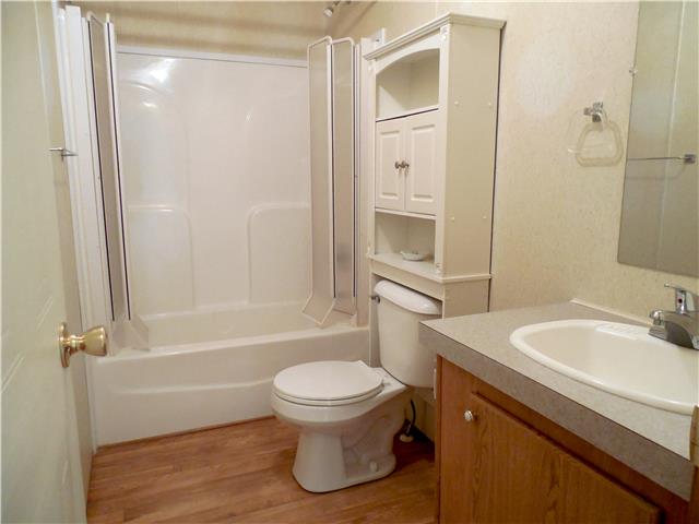 2410 Sylvia Road Dickson, TN 37055 - Photo 15 of 19 The second bathroom sits off the den and right between bedroom 2 and 3