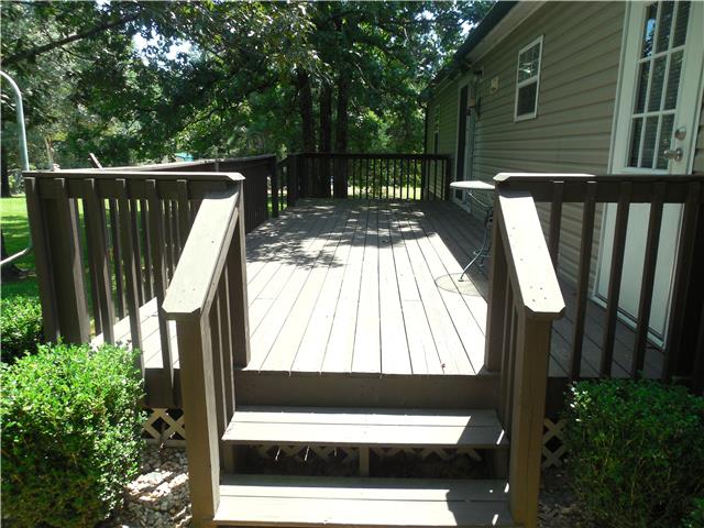 2410 Sylvia Road Dickson, TN 37055 - Photo 18 of 19 Walk out from the large sliding glass door of the dining room onto this 10'x28' deck. You can see your private rear yard and entertain all year long.