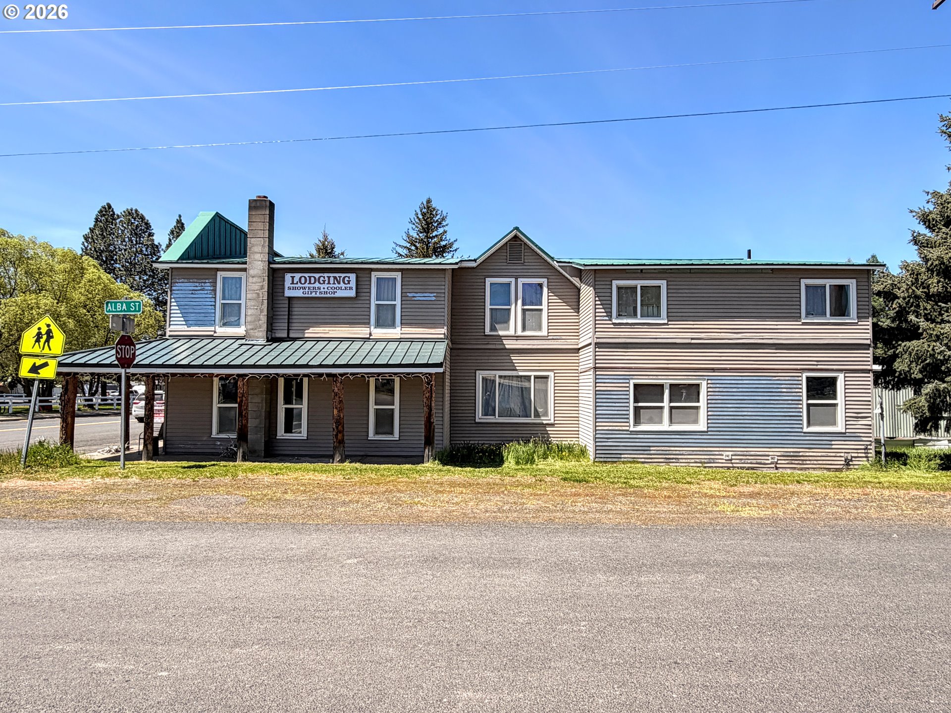 101 Main Street Ukiah, OR 97880 - Photo 4 of 17 a view of a house with a swimming pool