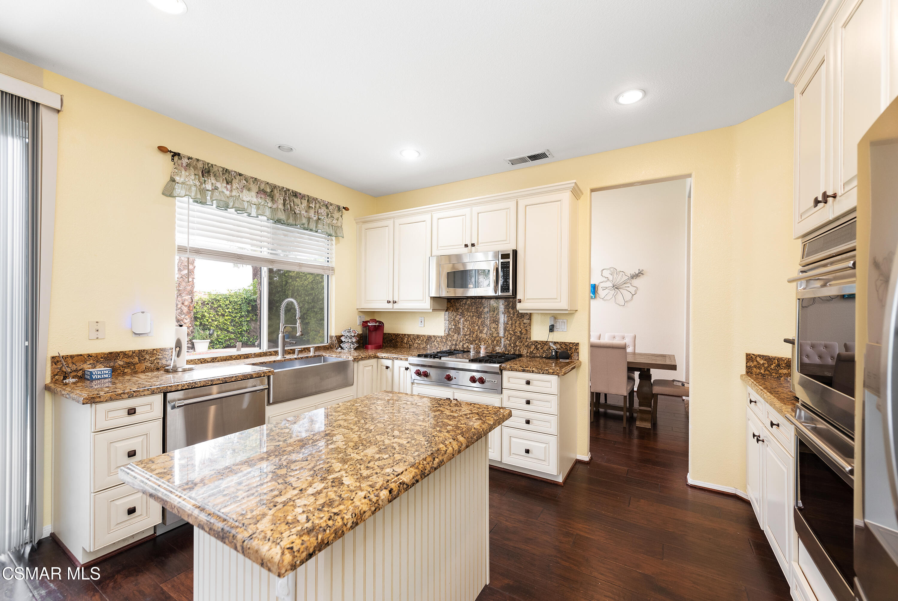 295 Cliffwood Drive Simi Valley, CA 93065 - Photo 13 of 49 a kitchen with stainless steel appliances granite countertop a stove oven and a refrigerator