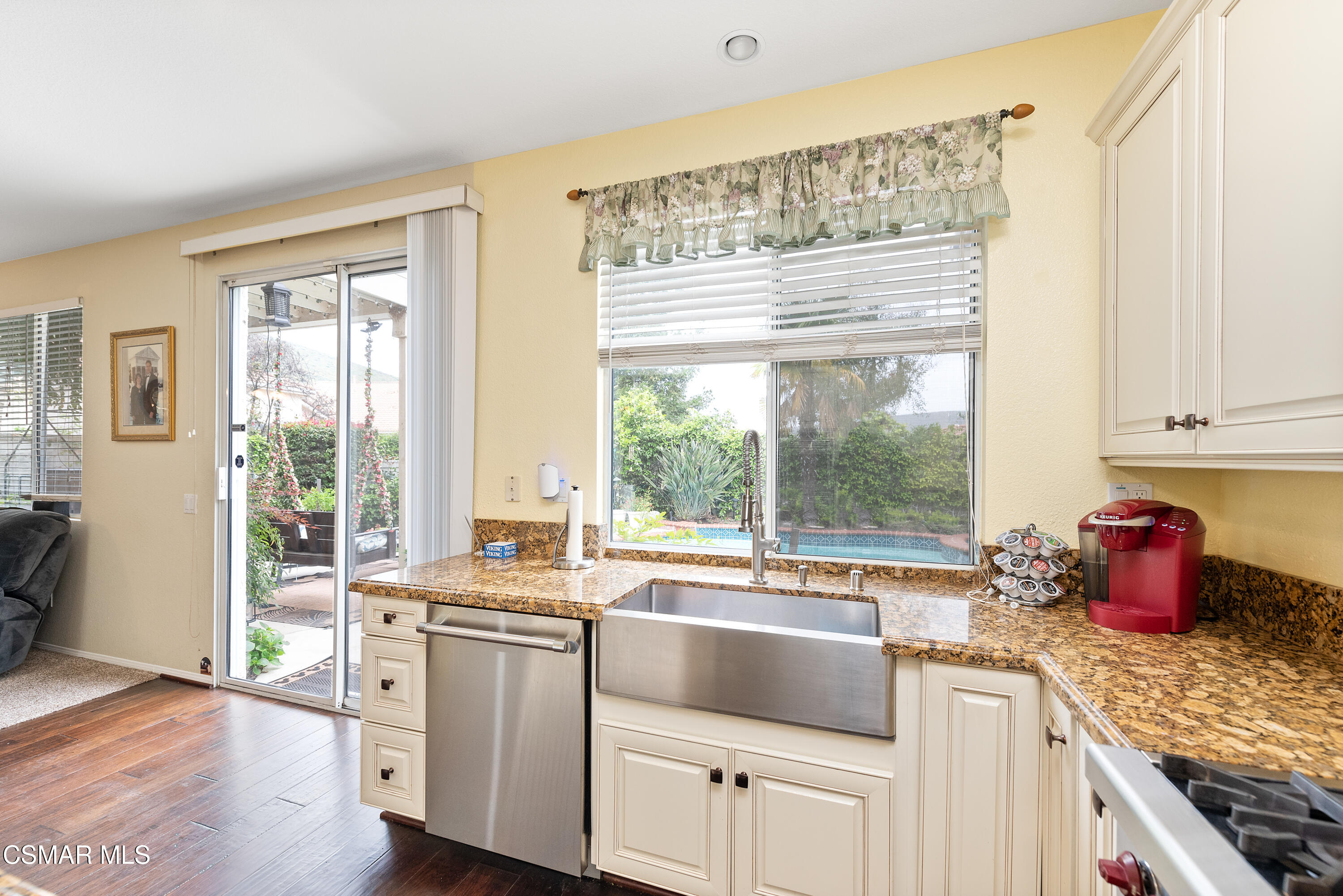 295 Cliffwood Drive Simi Valley, CA 93065 - Photo 15 of 49 a kitchen with a sink stove and cabinets