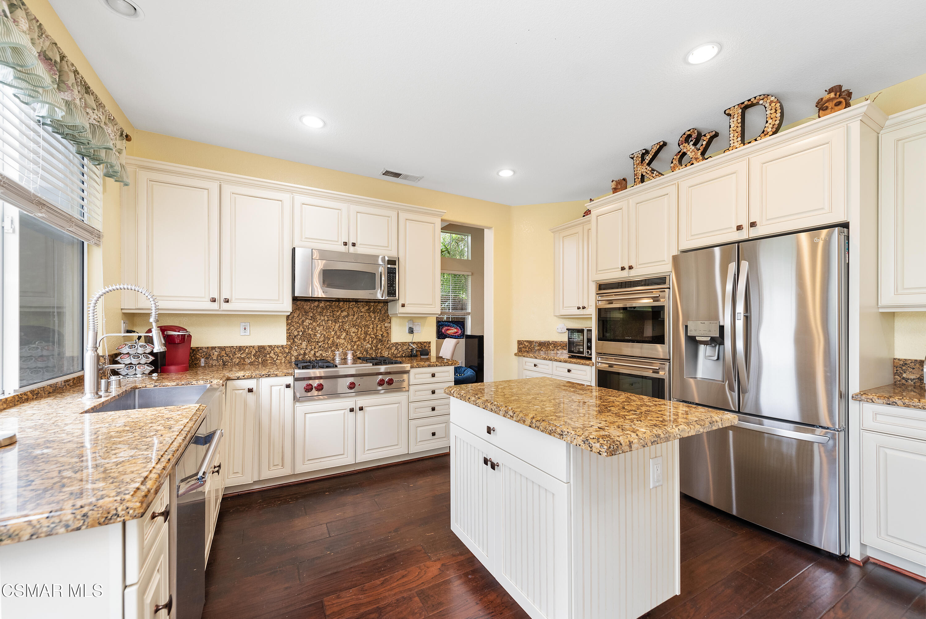 295 Cliffwood Drive Simi Valley, CA 93065 - Photo 18 of 49 a kitchen with stainless steel appliances granite countertop a refrigerator stove microwave and sink
