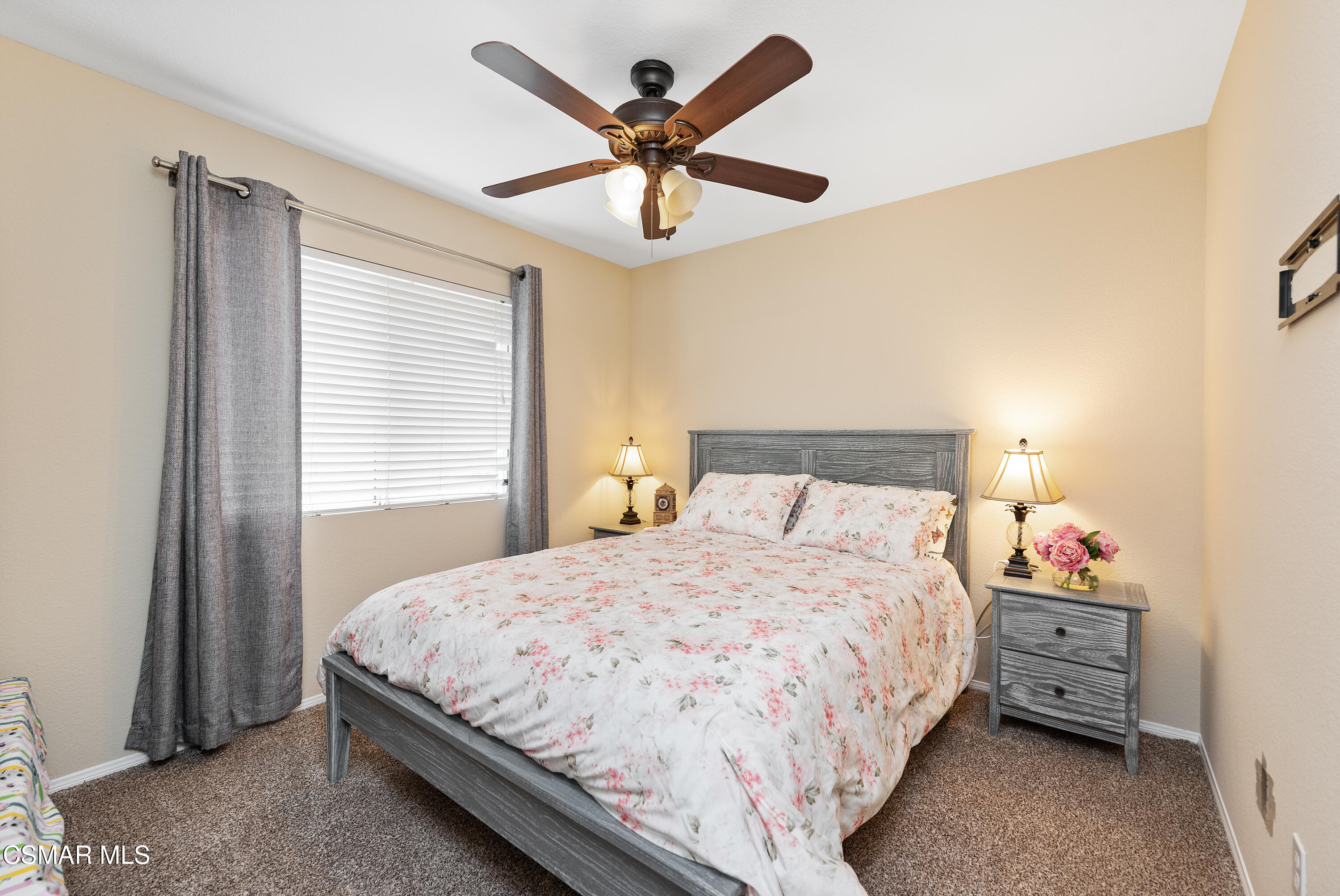 295 Cliffwood Drive Simi Valley, CA 93065 - Photo 24 of 49 a bedroom with a bed and a ceiling fan