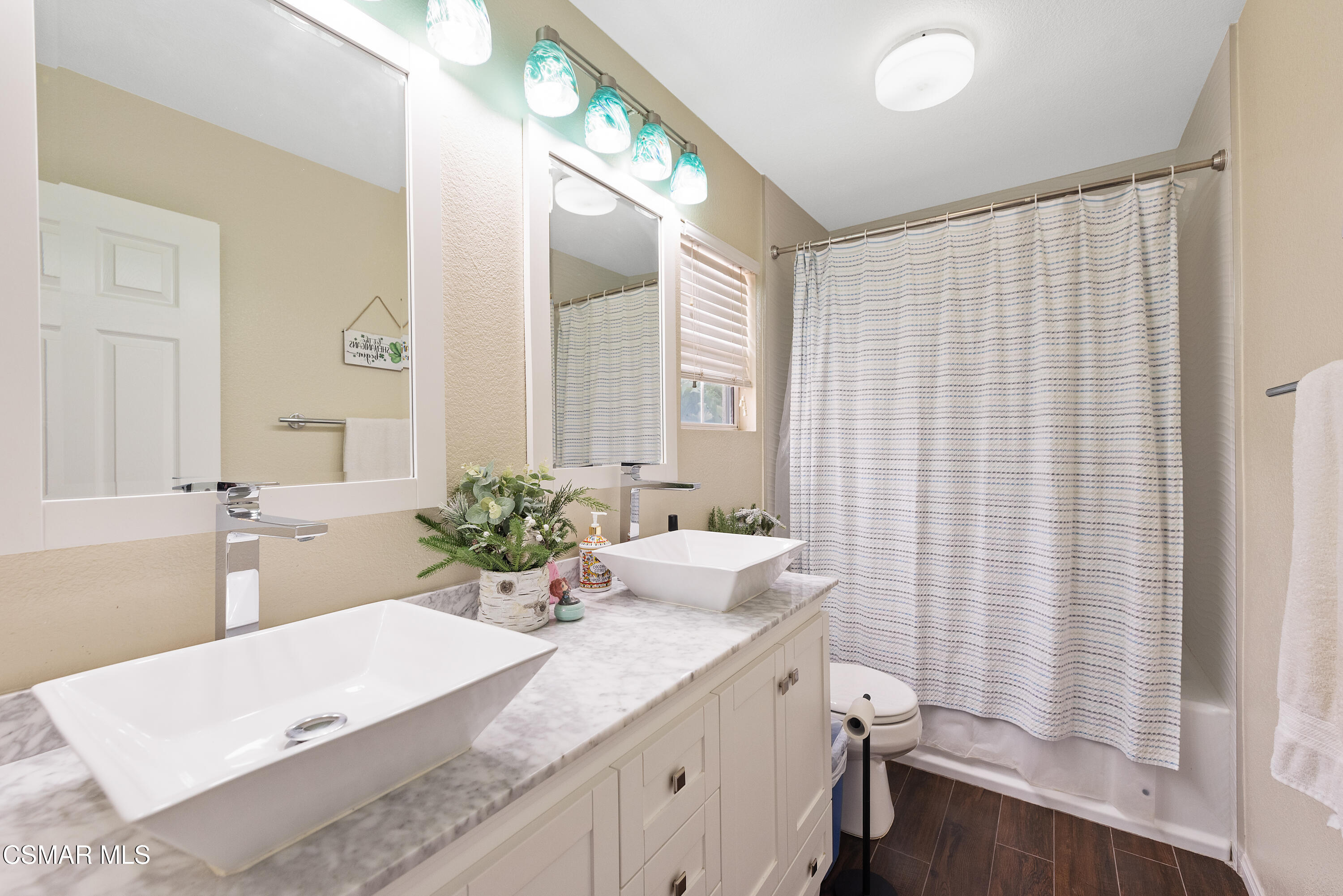 295 Cliffwood Drive Simi Valley, CA 93065 - Photo 25 of 49 a bathroom with a granite countertop sink a mirror and a shower