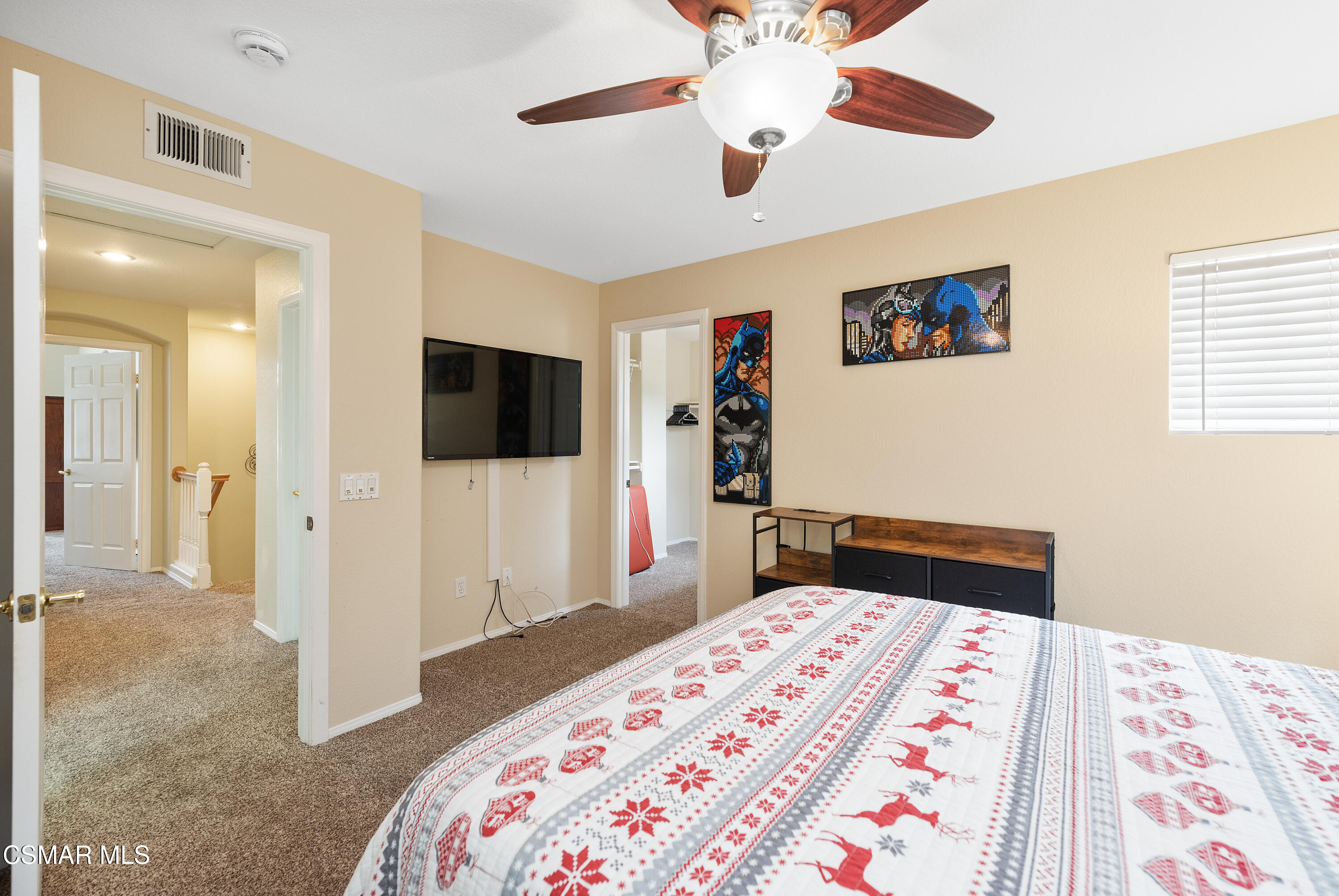 295 Cliffwood Drive Simi Valley, CA 93065 - Photo 26 of 49 a bedroom with a bed and a flat screen tv