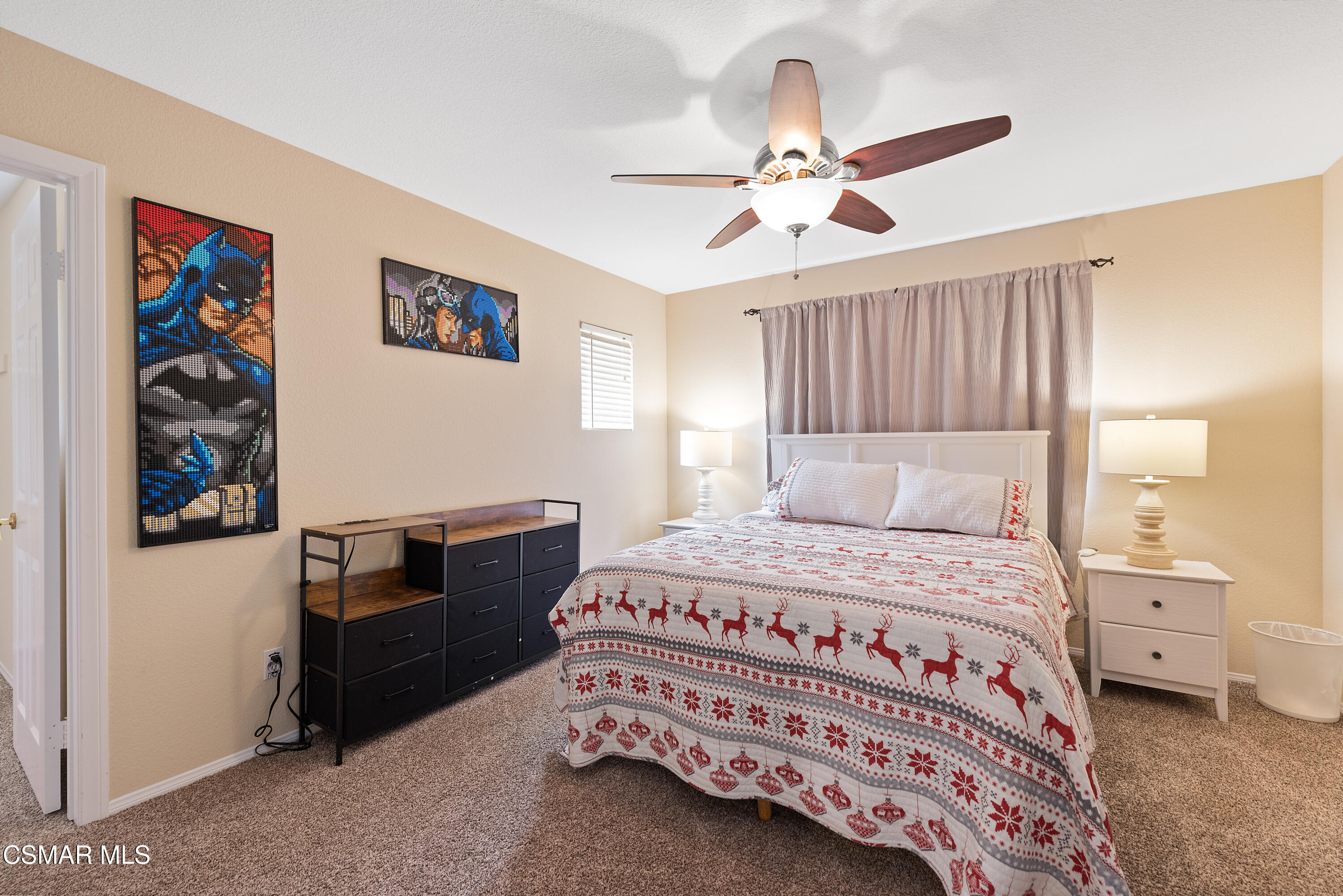 295 Cliffwood Drive Simi Valley, CA 93065 - Photo 27 of 49 a bedroom with a bed and a chandelier
