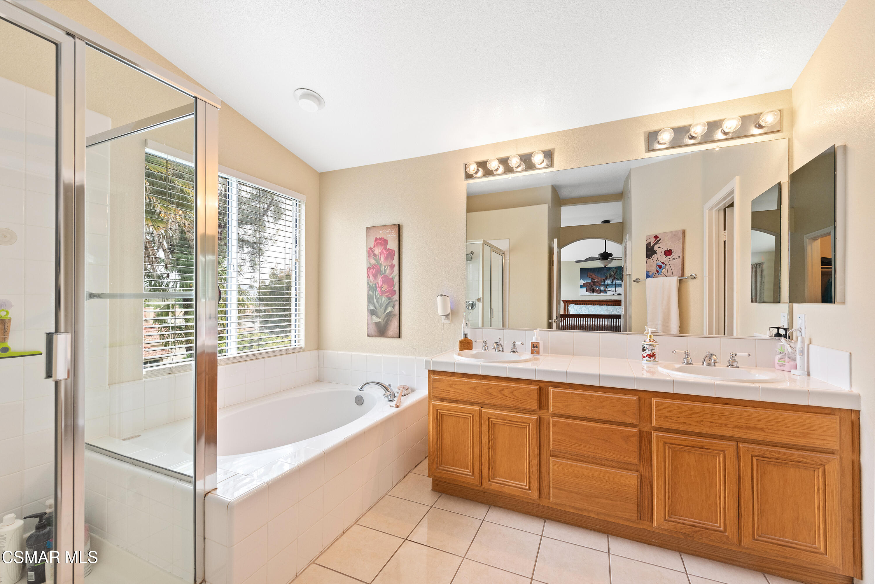 295 Cliffwood Drive Simi Valley, CA 93065 - Photo 33 of 49 a bathroom with a tub sink and mirror