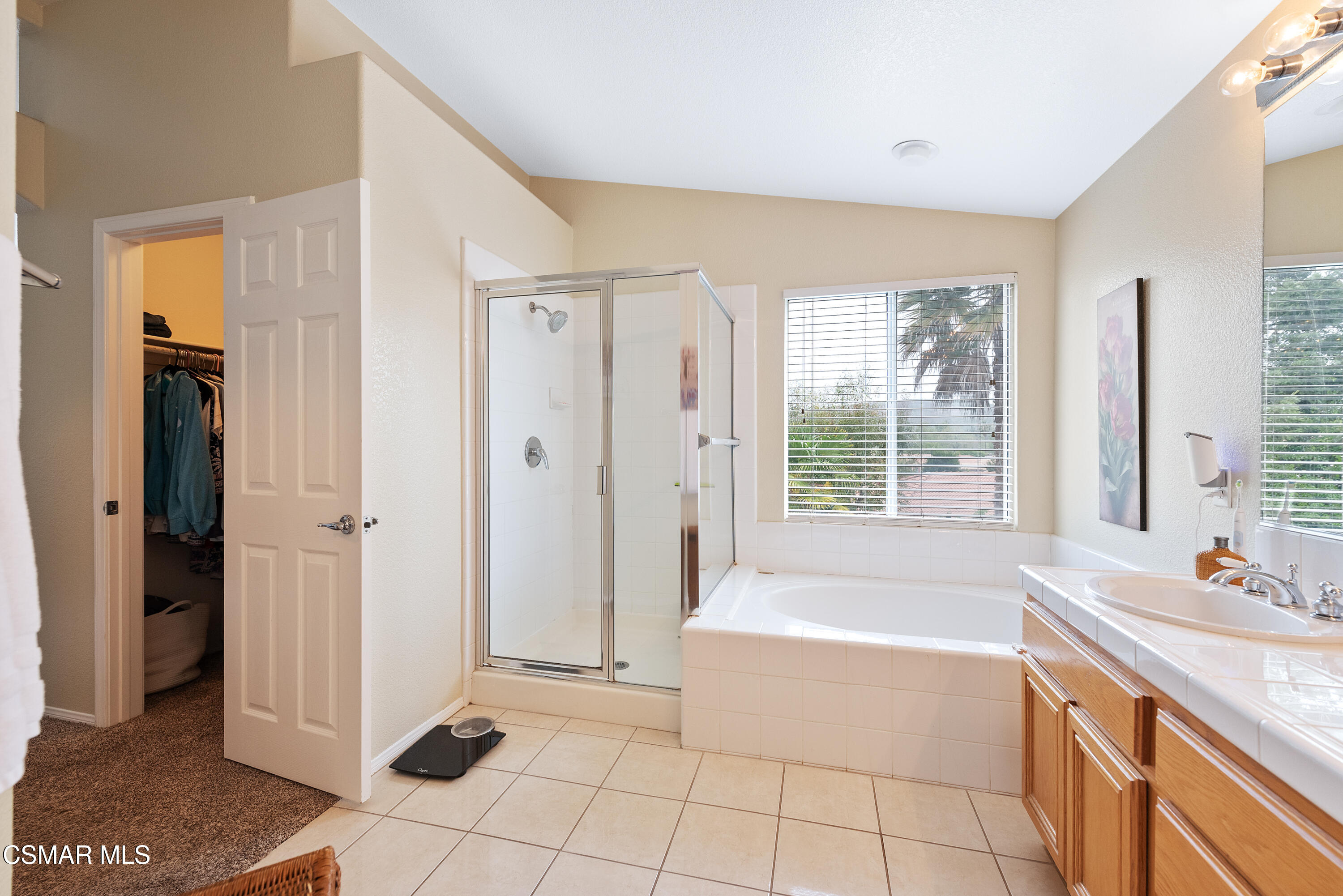 295 Cliffwood Drive Simi Valley, CA 93065 - Photo 34 of 49 a spacious bathroom with a tub shower and a sink