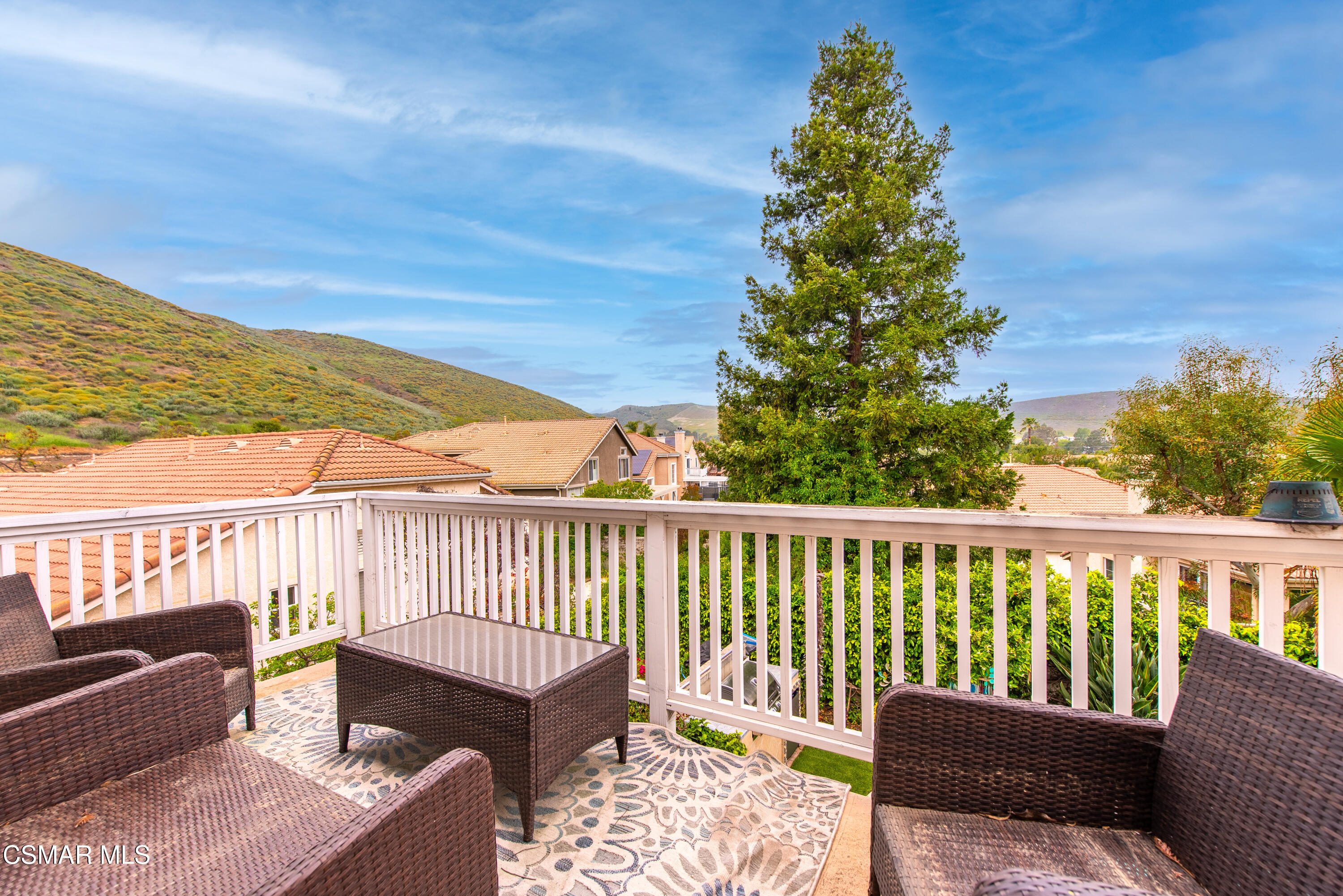 295 Cliffwood Drive Simi Valley, CA 93065 - Photo 36 of 49 a balcony with wooden floor and outdoor seating