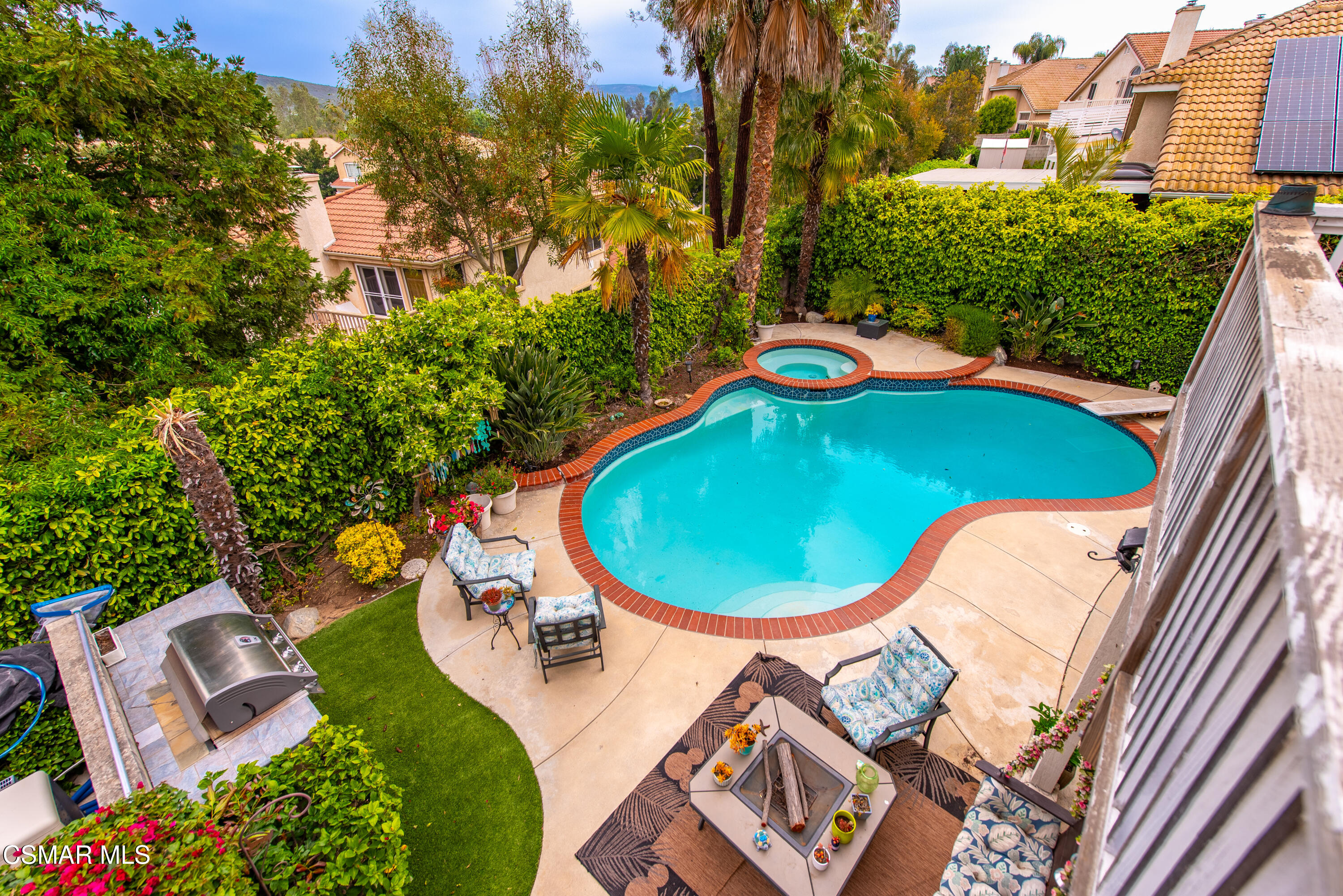 295 Cliffwood Drive Simi Valley, CA 93065 - Photo 38 of 49 an aerial view of a swimming pool with a yard and plants