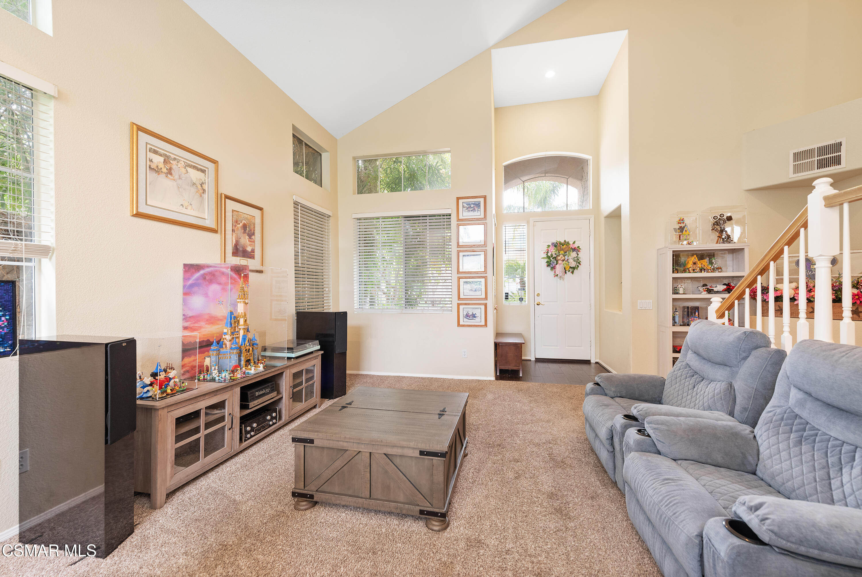 295 Cliffwood Drive Simi Valley, CA 93065 - Photo 4 of 49 a living room with furniture and a chandelier