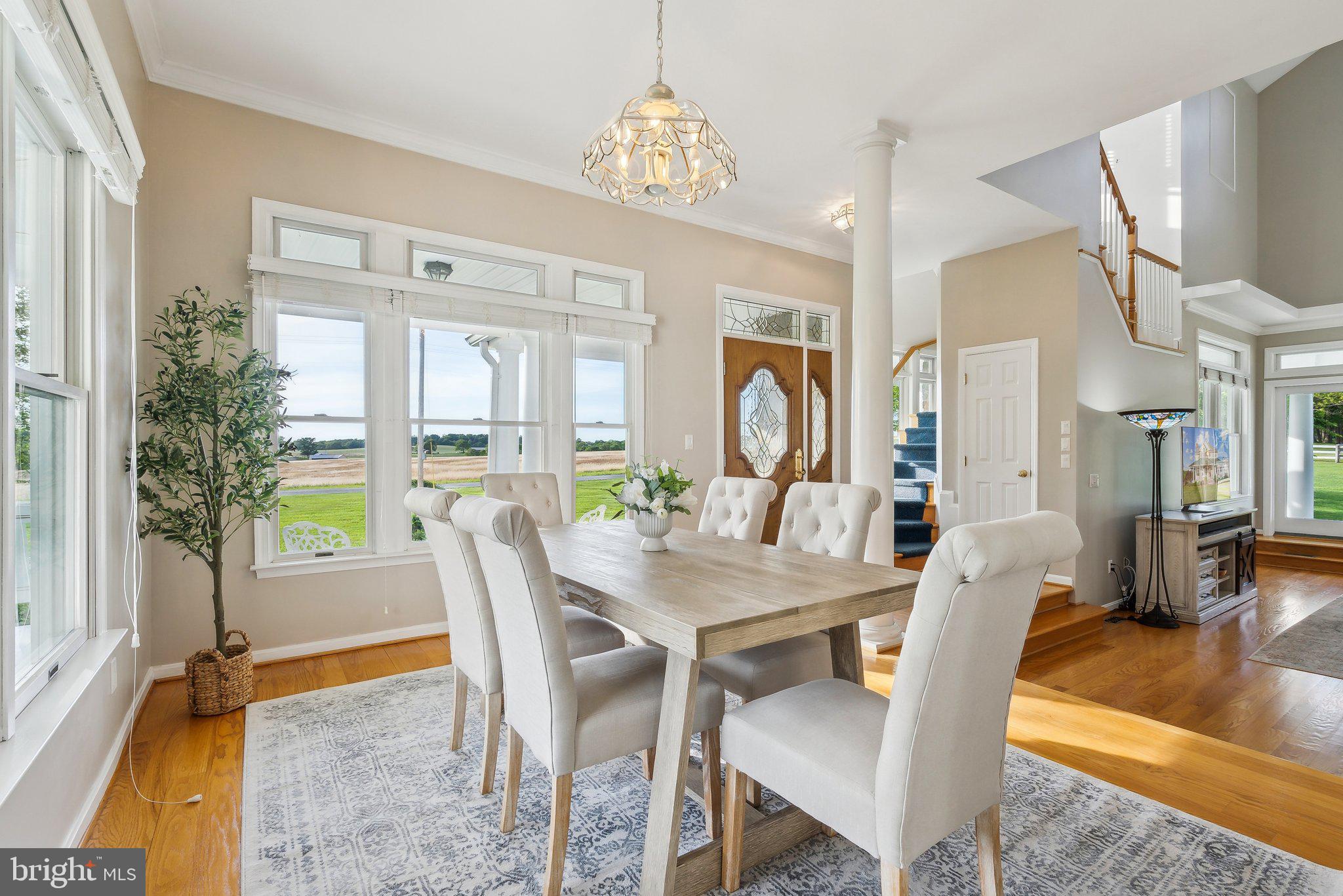 20437 Peach Tree Road Dickerson, MD 20842 - Photo 14 of 53 a view of a dining room with furniture window and wooden floor