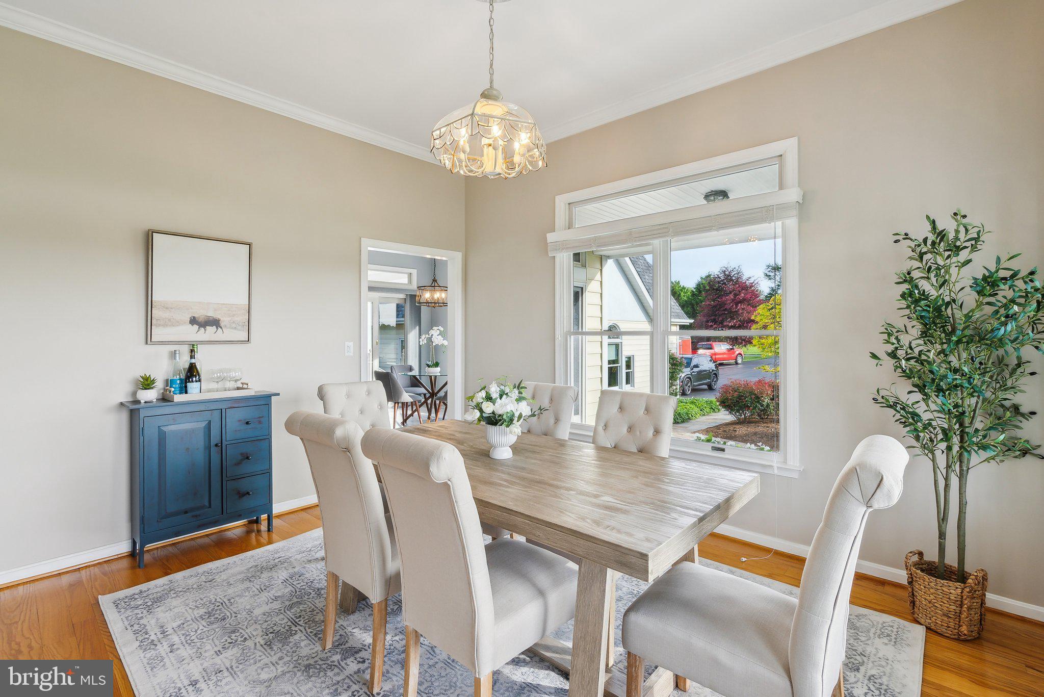 20437 Peach Tree Road Dickerson, MD 20842 - Photo 15 of 53 a view of a dining room with furniture and wooden floor