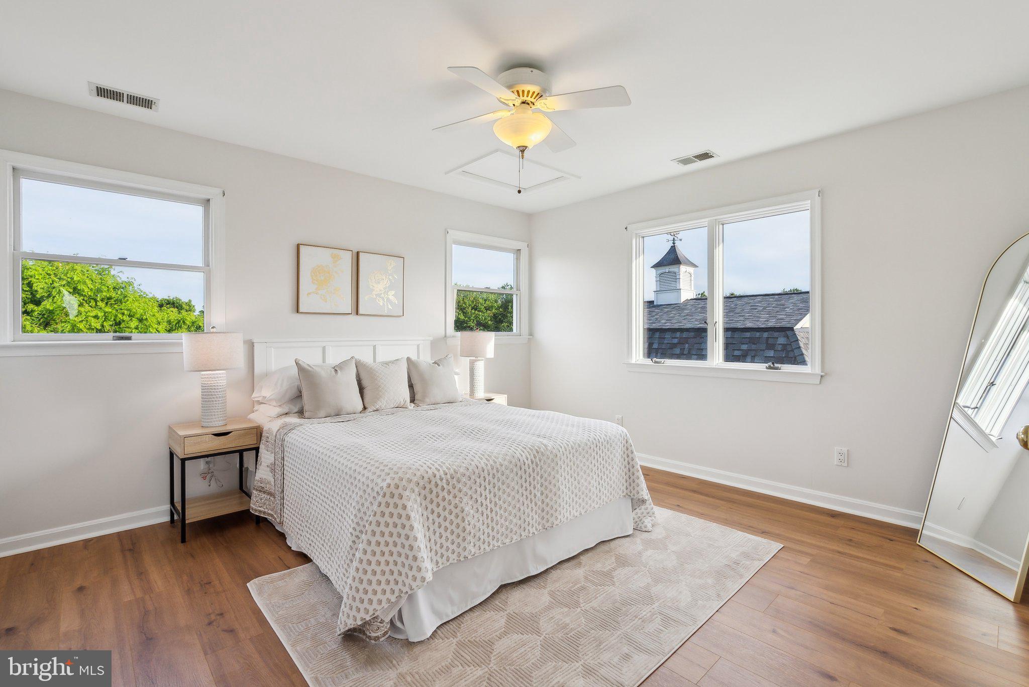 20437 Peach Tree Road Dickerson, MD 20842 - Photo 24 of 53 a bedroom with a bed and a chandelier