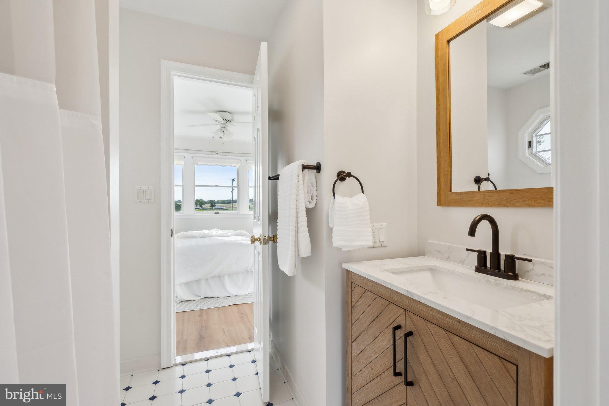 20437 Peach Tree Road Dickerson, MD 20842 - Photo 25 of 53 a bathroom with a sink vanity and a mirror