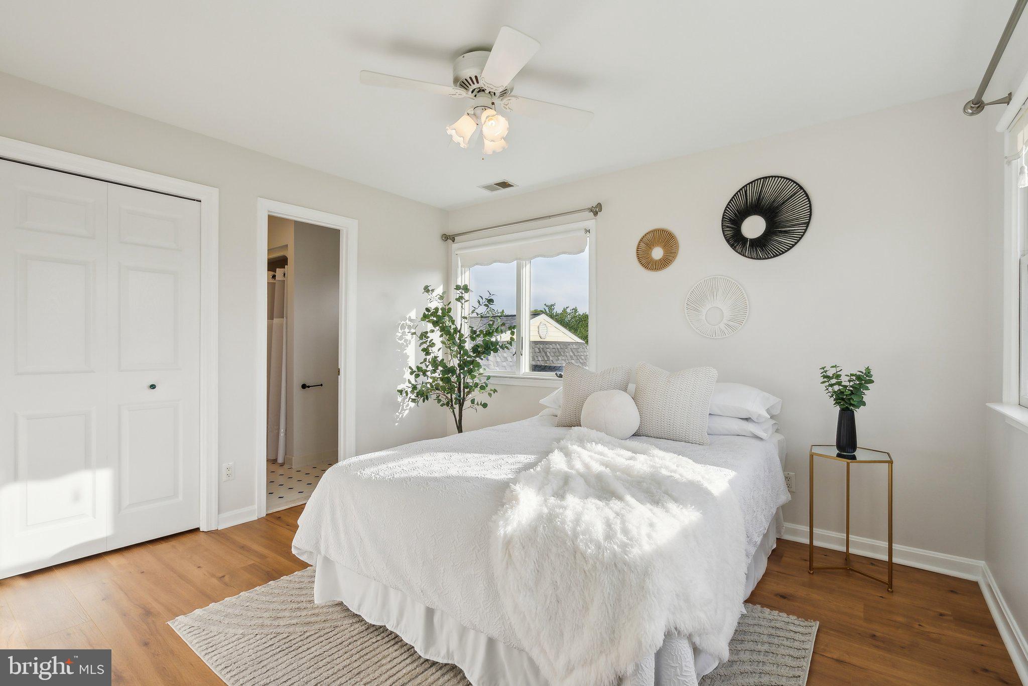 20437 Peach Tree Road Dickerson, MD 20842 - Photo 26 of 53 a bedroom with a large bed and a chandelier