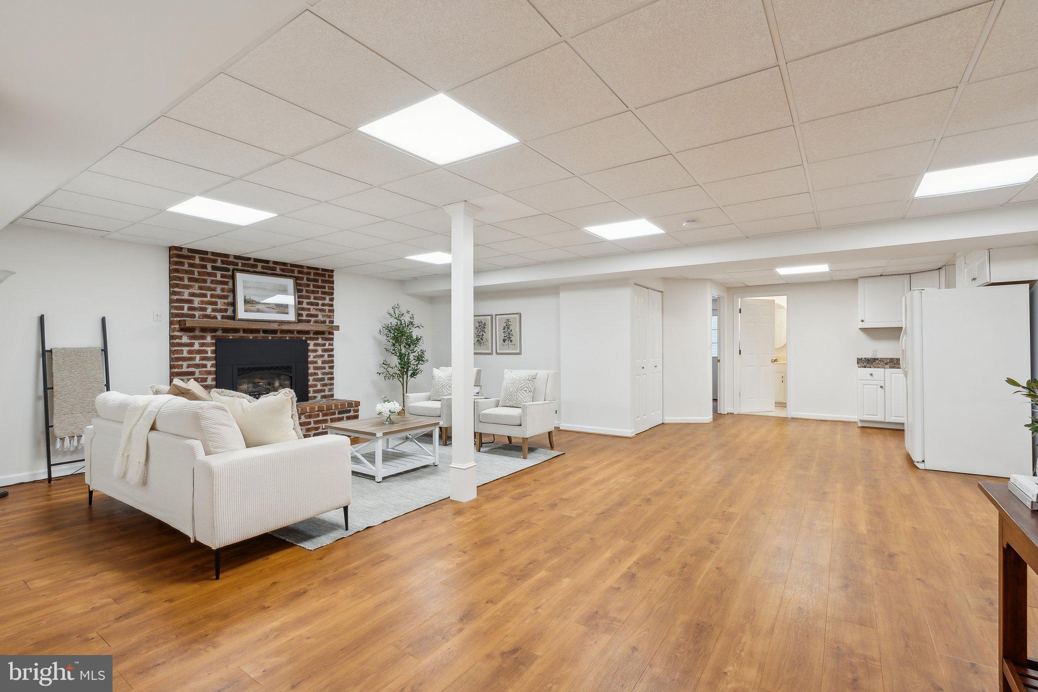 20437 Peach Tree Road Dickerson, MD 20842 - Photo 27 of 53 a living room with furniture and a fireplace