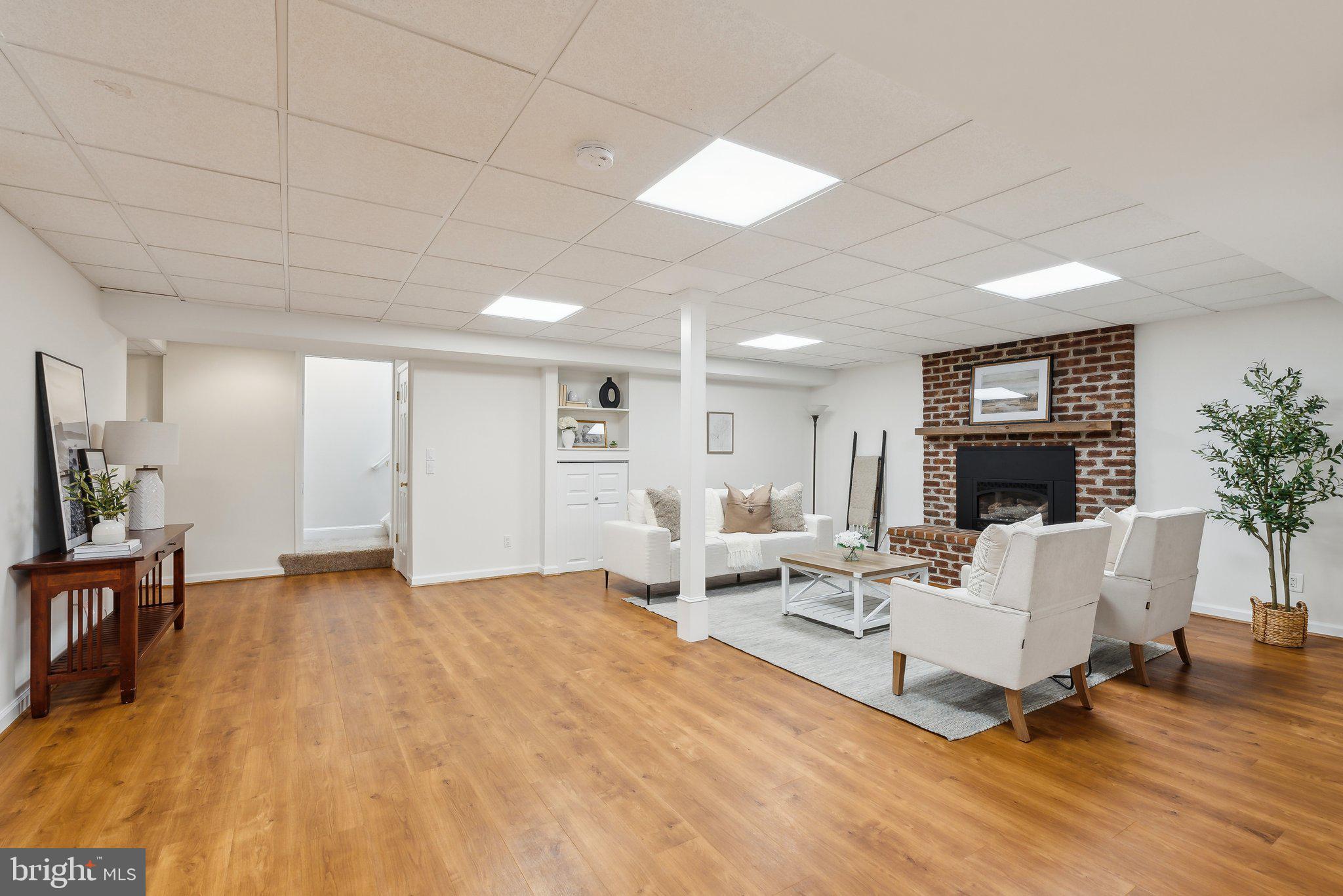 20437 Peach Tree Road Dickerson, MD 20842 - Photo 30 of 53 a living room with furniture and a fireplace