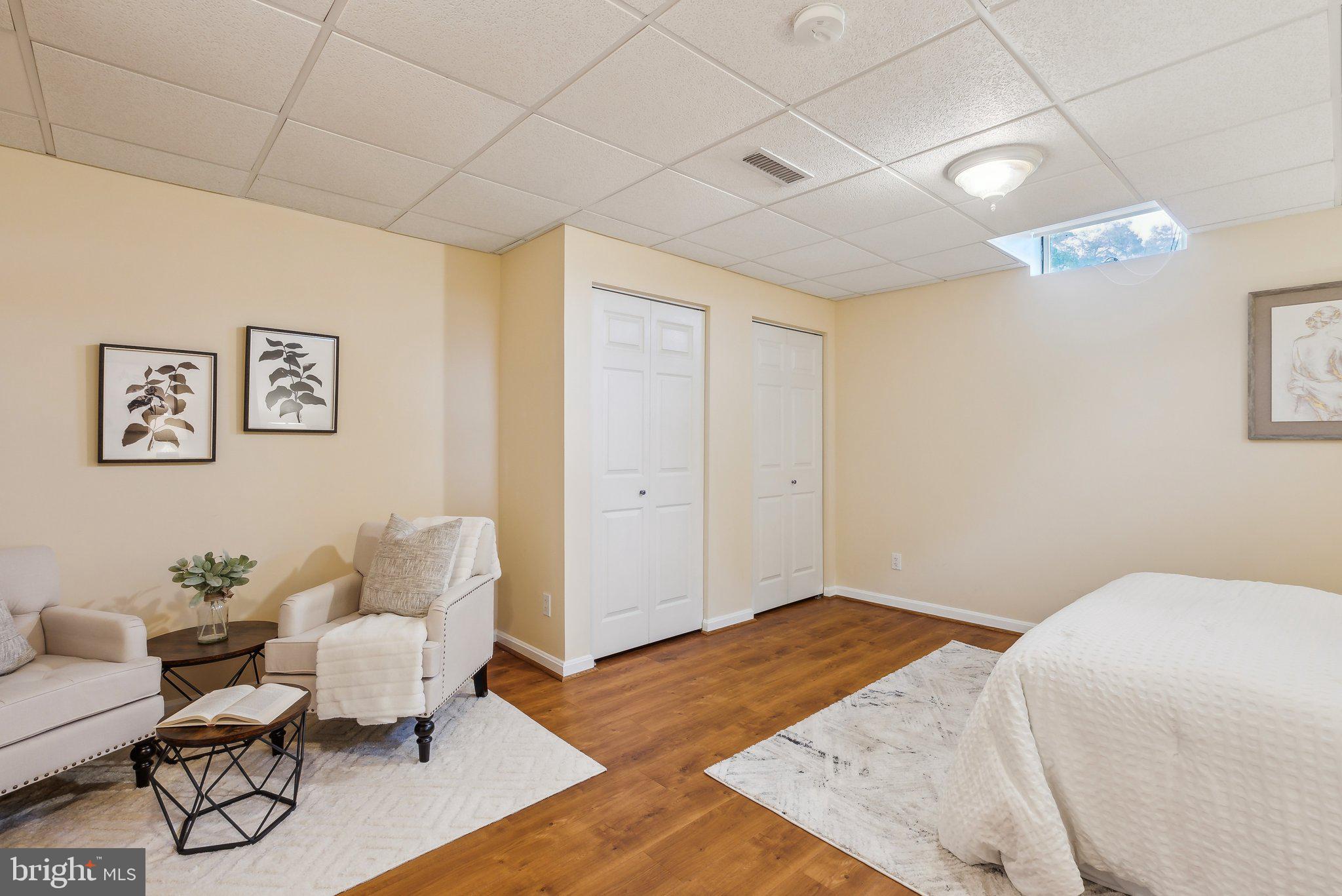 20437 Peach Tree Road Dickerson, MD 20842 - Photo 32 of 53 a bedroom with a bed and wooden floor