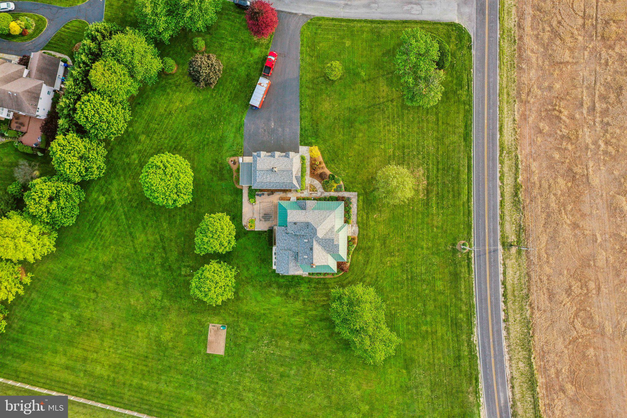 20437 Peach Tree Road Dickerson, MD 20842 - Photo 41 of 53 a green field with some trees in the background