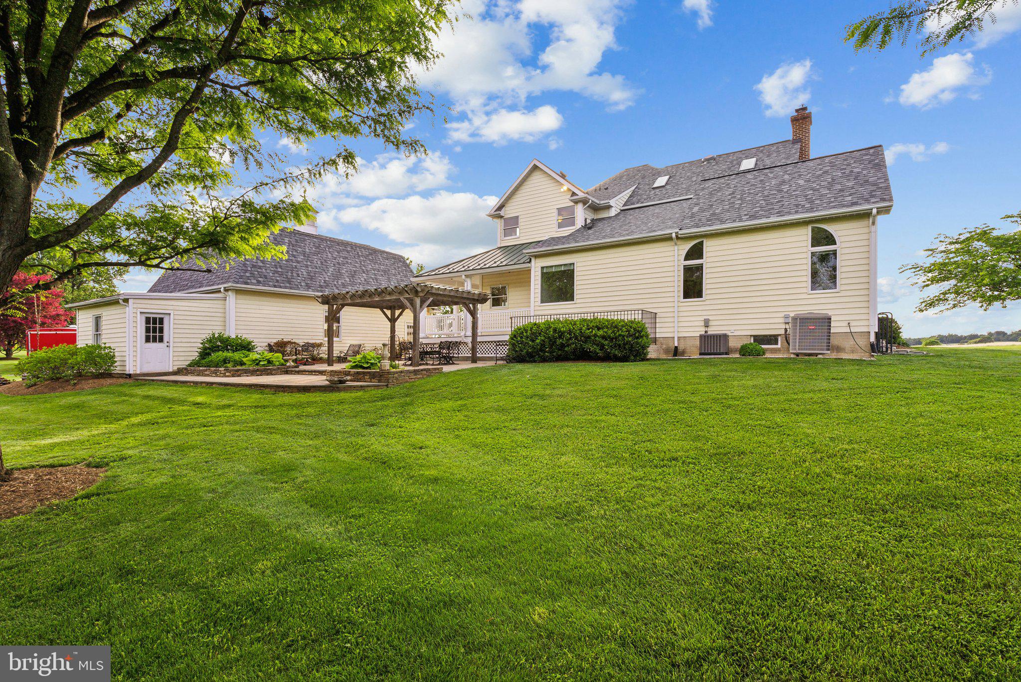 20437 Peach Tree Road Dickerson, MD 20842 - Photo 45 of 53 a front view of a house with a garden and yard