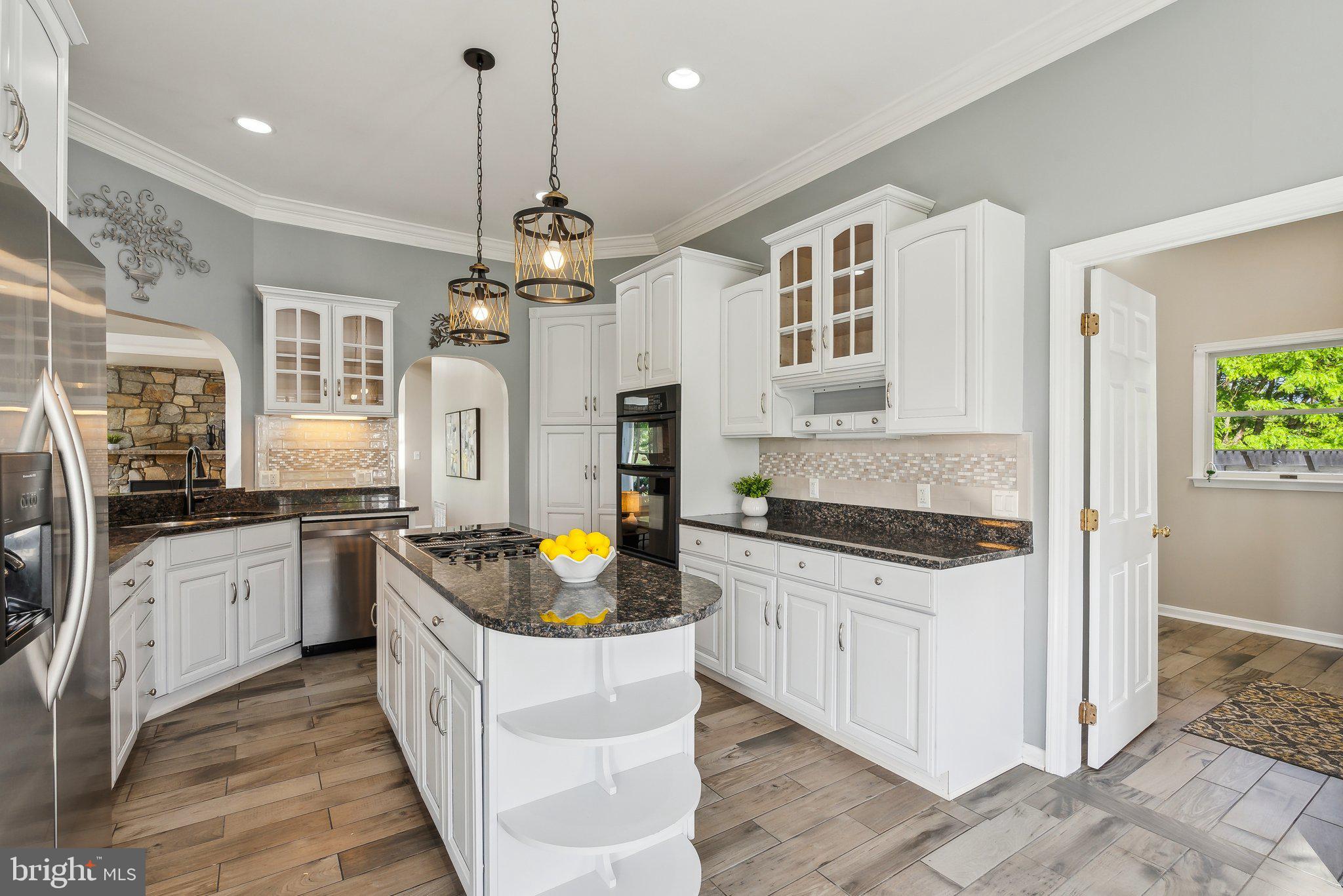20437 Peach Tree Road Dickerson, MD 20842 - Photo 9 of 53 a kitchen with stainless steel appliances granite countertop a stove a sink and a refrigerator