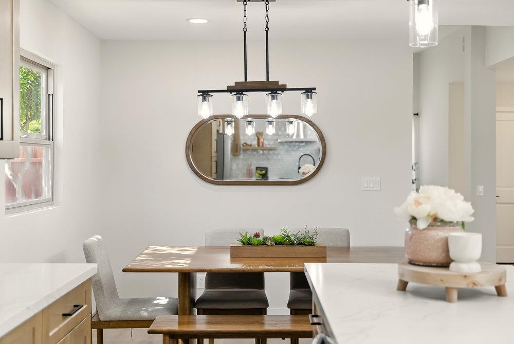 1180 Peterson Drive Gilroy, CA 95020 - Photo 11 of 45 a living room with a table chairs and a chandelier