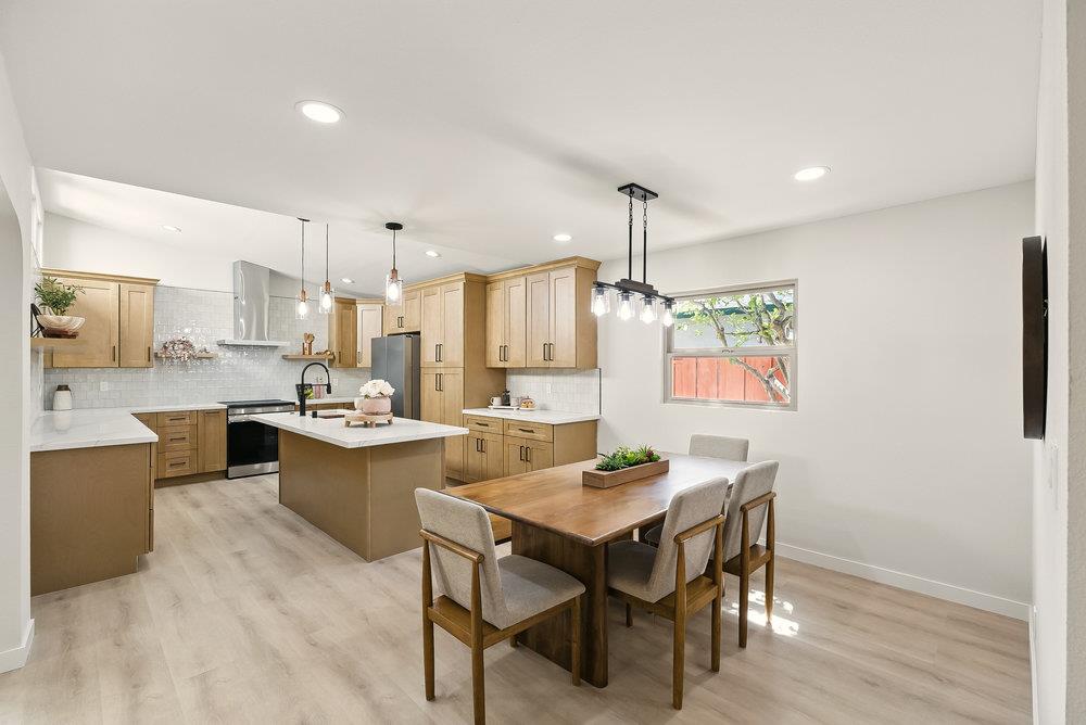 1180 Peterson Drive Gilroy, CA 95020 - Photo 12 of 45 a kitchen with a table and chairs in it