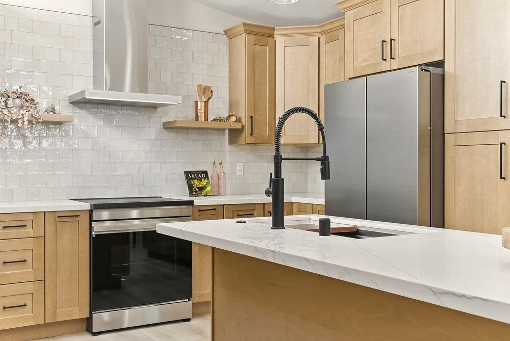 1180 Peterson Drive Gilroy, CA 95020 - Photo 16 of 45 a kitchen with stainless steel appliances a sink and a stove top oven