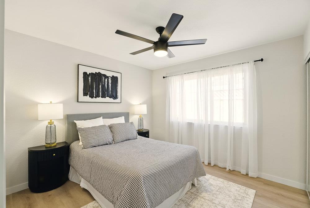 1180 Peterson Drive Gilroy, CA 95020 - Photo 27 of 45 a bedroom with a bed and painting on the wall