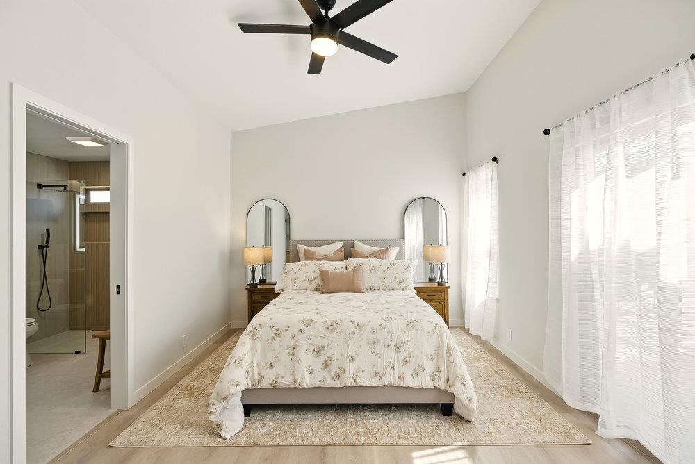 1180 Peterson Drive Gilroy, CA 95020 - Photo 31 of 45 a bedroom with a bed mirror and window