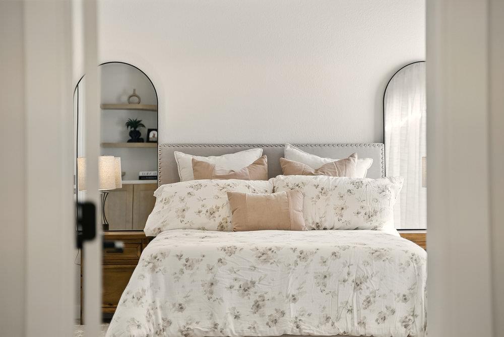 1180 Peterson Drive Gilroy, CA 95020 - Photo 32 of 45 a bedroom with a bed and a painting on the wall