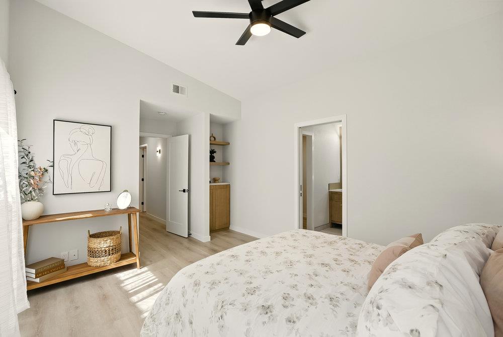 1180 Peterson Drive Gilroy, CA 95020 - Photo 34 of 45 a bedroom with a bed and a tv on the dresser