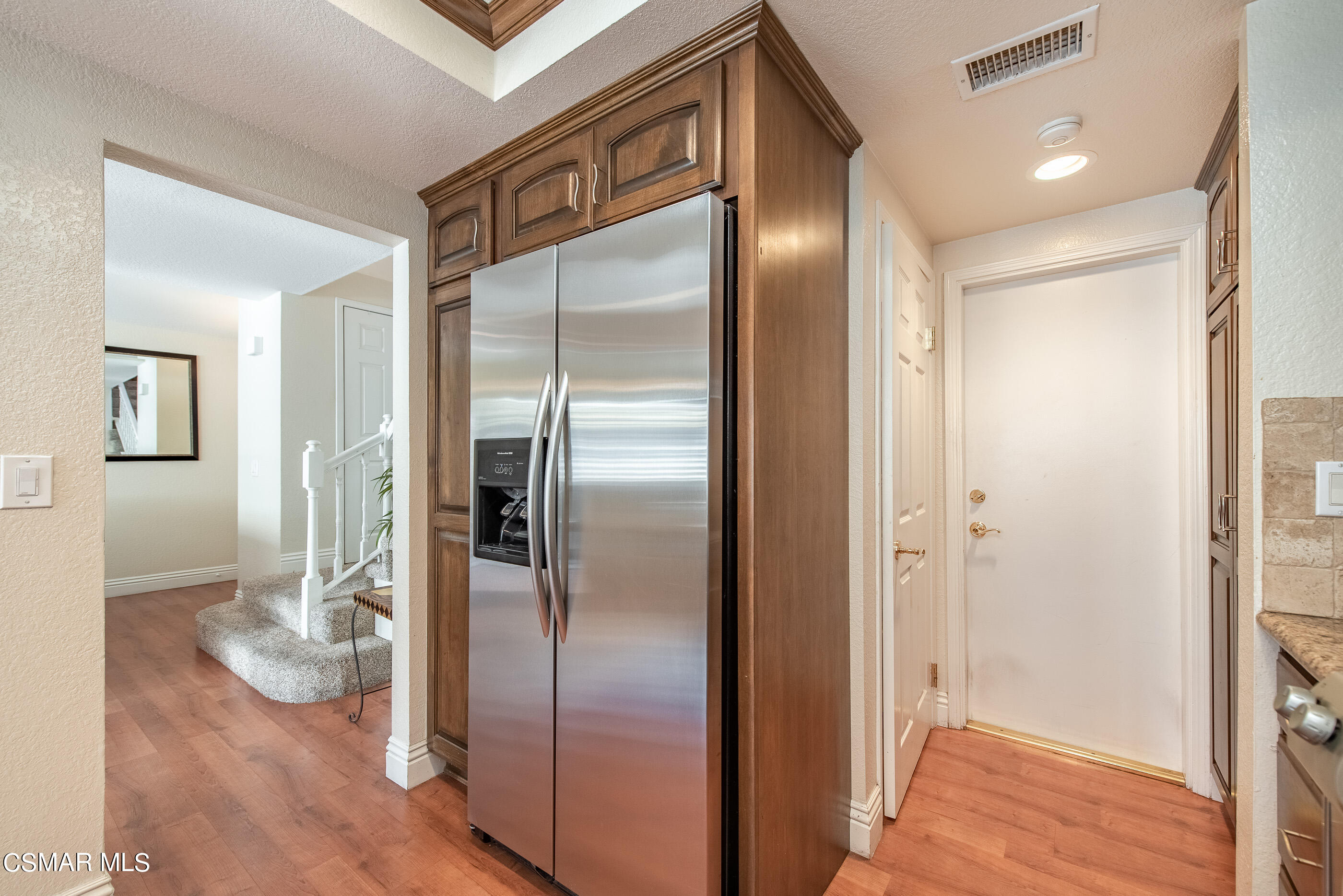 1940 Rory Lane, Unit 3 Simi Valley, CA 93063 - Photo 12 of 33 a view of a refrigerator in kitchen and an empty room